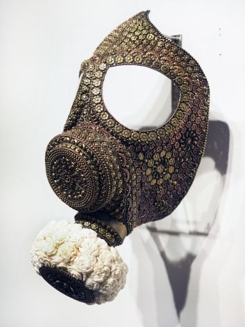 P.D. Pulak   Untitled (Gas Mask for the Rich & Famous) Shola flowers, brass  12.5 x 6 in.  2019